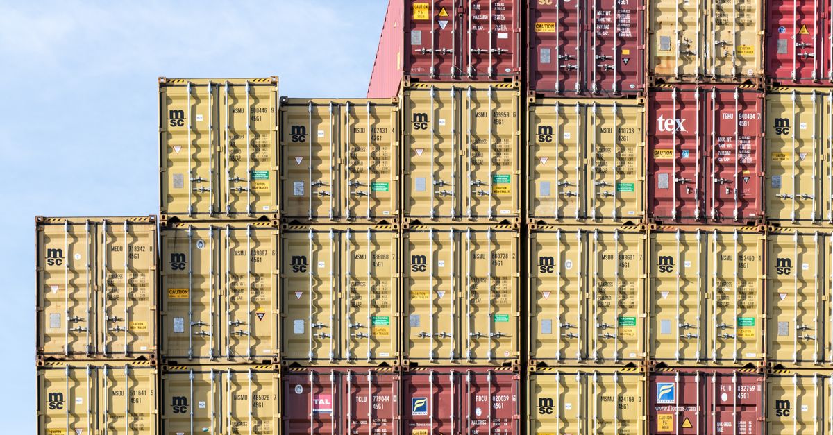 Colorful stacked shipping containers at Hamburg port, showcasing global trade and logistics.